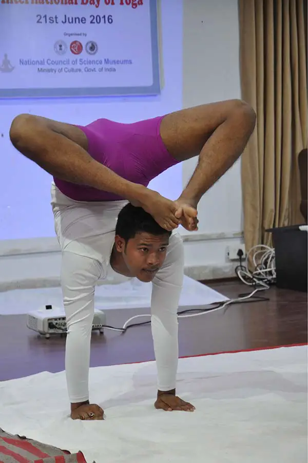 Various Difficult Yoga Poses. Yoga Teacher Doing Exercises On Yoga. Stock  Photo, Picture and Royalty Free Image. Image 99223544.